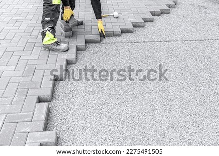 new sidewalk made of concrete interlocking paving blocks Royalty-Free Stock Photo #2275491505