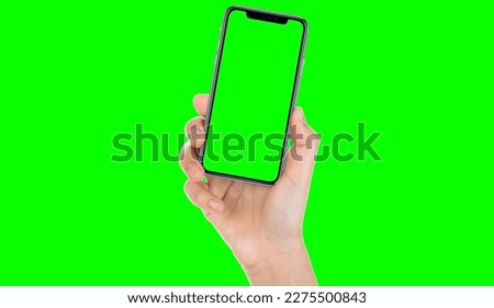 Man or woman hand holding black smartphone, close-up hand touching phone, Man's hand shows mobile smartphone with green screen in vertical and horizontal position, isolated white and green Background.