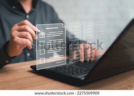 Electronic smart checklist and document management on virtual screens concept, business people check electronic documents on digital documents, paperless on borderless communication technology Royalty-Free Stock Photo #2275509909
