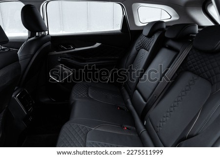 Modern SUV car inside. Leather back passenger seats in modern luxury car. Comfortable leather seats. Royalty-Free Stock Photo #2275511999