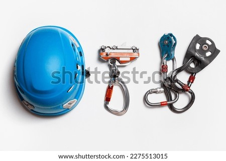 protective helmet for work at height. climbing equipment. fall protection mechanism. set of carbines. view from above. on a white background. Royalty-Free Stock Photo #2275513015