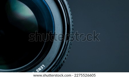Camera lens on a black background. Close-up of a camera lens.