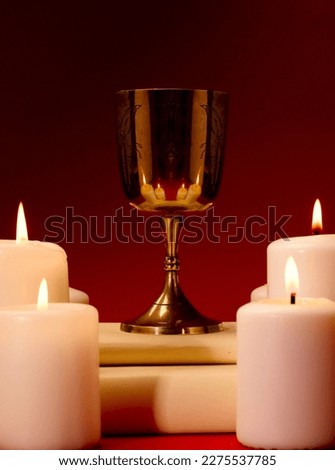 christian chalice with 'candles in the background.  Royalty-Free Stock Photo #2275537785