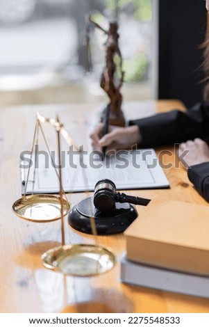 female business woman lawyers working at the law firms. Judge gavel with scales of justice. Legal law, lawyer, documents, advice and justice concept.
