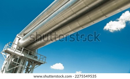 Pipeline against the blue sky and clouds, bottom view.