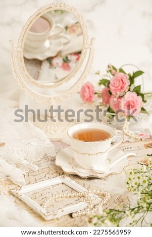 Still life a cup of tea, victorian style Royalty-Free Stock Photo #2275565959