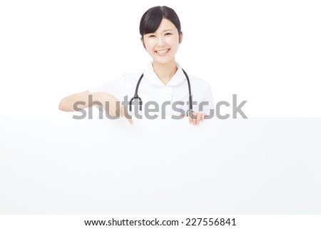 smiling Japanese nurse with Bulletin Board