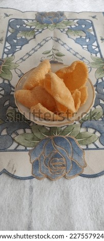 crackers as an additional side dish in Indonesia which is served in a small bowl