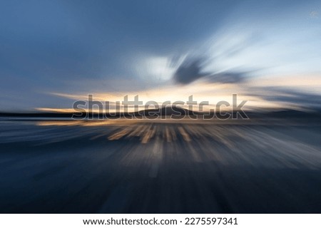 Zoom blur effect at dawn in coastal sunrise for background or conceptual use