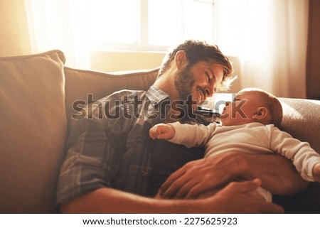 I promise you, Ill always be around. a young father and his baby boy in the living room.