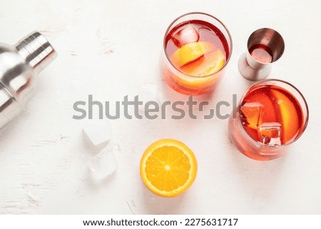 Different delicious cocktails on table. Alcoholic coctail with fruit, herbs and ice on a white background. Top view. Royalty-Free Stock Photo #2275631717