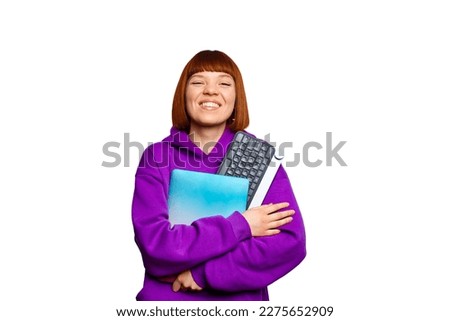 Smiling woman holding a laptop, keyboard. High quality photo