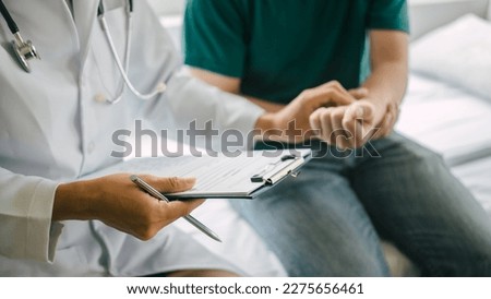 Male patient consulting a medical specialist at hospital. wrist pain