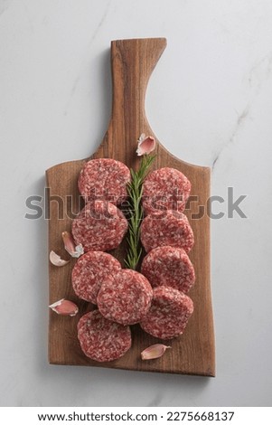 Patty of minced meat for burger. White background. Top view