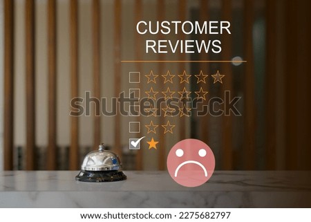 Customer Experience dissatisfied Concept, silver service bell on hotel reception desk with Sadness Emotion Face, Bad review, bad service dislike bad quality, low rating, social media not good.