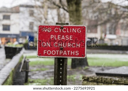 No cycling on church footpaths against snowy town background, travel and information concept illustration.