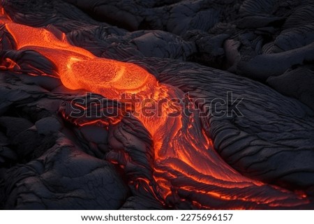 Lava was in the cracks of the earth to view the texture of the glow of volcanic magma in the cracks. Royalty-Free Stock Photo #2275696157