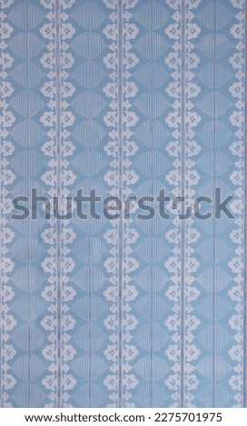Old wallpaper on the wall. Old wallpaper for texture or background. Royalty-Free Stock Photo #2275701975