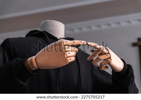 Wooden hand posting poiting sign isolated with headless body. Gesture fingers. Forefingers pointing.