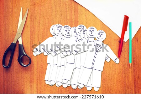 Many paper male characters of office staff Royalty-Free Stock Photo #227571610
