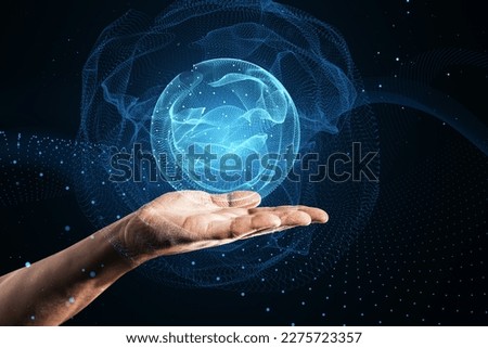 Close up of male hand using polygonal globe hologram on dark background. World map with global social network. Future concept. Blue futuristic background with planet