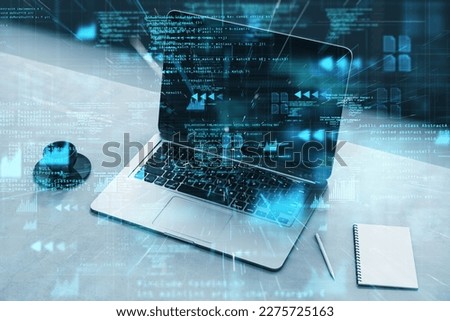 Close up of laptop computer on desktop with coffee cup, notepad and glowing hacking tech hologram on blurry background. Crypto, security and criminal concept. Double exposure