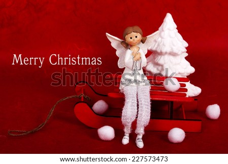  Christmast tree, White Christmas angel on red wooden background 