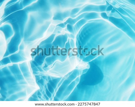 Closeup​ blur​ abstract​ of​ surface​ blue​ water. Abstract​ of​ surface​ blue​ water​ reflected​ with​ sunlight​ for​ background.Top​ view​ of blue​ water.​ Water​ splashed​ use​ for​ graphic​ design Royalty-Free Stock Photo #2275747847