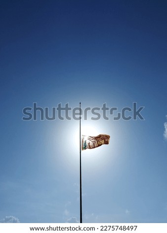 Sunlight passing through the flag with blue sky