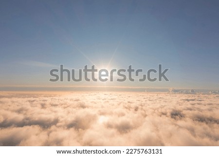 Aerial view White clouds in blue sky. Top. View from drone. Aerial bird's eye. Aerial top view cloudscape. Texture of clouds. View from above. Sunrise or sunset over clouds Royalty-Free Stock Photo #2275763131