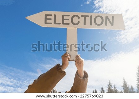 Vote road sign, arrow on blue sky background. One way blank road sign with copy space. Arrow on a pole pointing in one direction. Election.