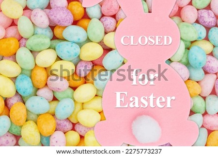 Closed for Easter sign on a bunny with Easter eggs  Royalty-Free Stock Photo #2275773237