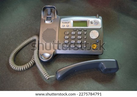 DECT radiotelephone Base station. Dect cordless phone wireless phone, radiotelephone, radio phone on grey background. Royalty-Free Stock Photo #2275784791