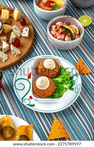 Traditional mexican food. Cheese balls with ham and garlic. Colorful Food Table Celebration Delicious Party Meal Concept. 