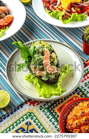Traditional mexican food. Avocado with shrimp. Colorful Food Table Celebration Delicious Party Meal Concept. 