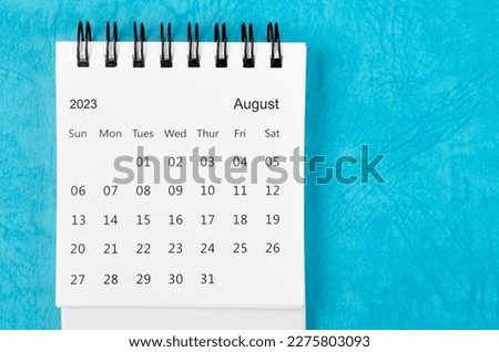 August 2023 Monthly desk calendar for 2023 year on blue background. Royalty-Free Stock Photo #2275803093