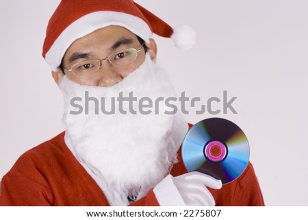 Asian Santa Claus holding a compact disc.