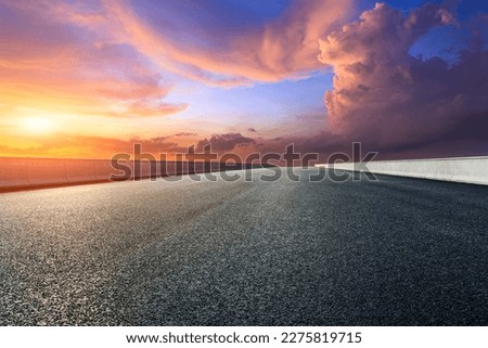 Asphalt highway and sky sunset clouds background