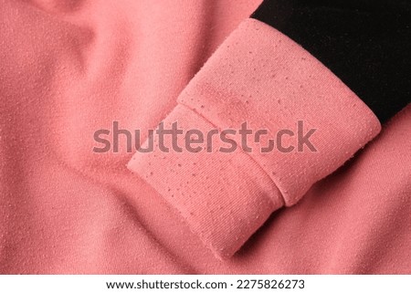 Colorful sweater with lint as background, top view. Before using of fabric shaver Royalty-Free Stock Photo #2275826273