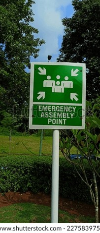 The Sign board of Assembly point at office areas. Gathering Point signs are open areas near office environmental centers which in the event of a disaster become gathering points for people to evacuate