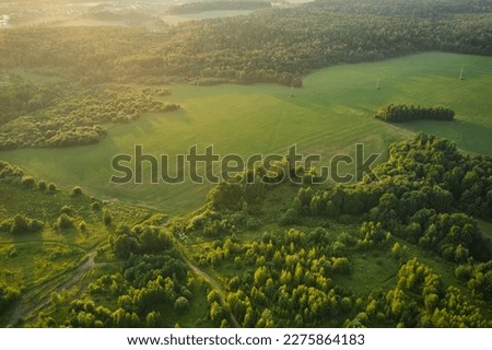 Beautiful aerial landscape on green backdrop. Beautiful scenery. Beautiful natural landscape. Natural background. Air transportation. Aerial view. Top view. Royalty-Free Stock Photo #2275864183
