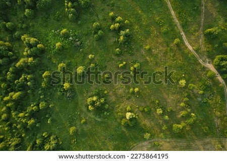 Beautiful aerial landscape on green backdrop. Beautiful scenery. Beautiful natural landscape. Natural background. Air transportation. Aerial view. Top view. Royalty-Free Stock Photo #2275864195