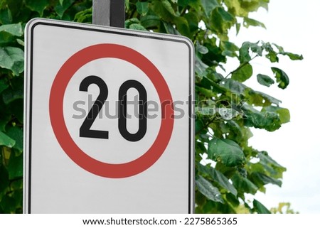 Post with traffic sign Speed Limit outdoors