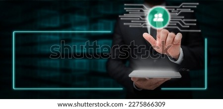 Man in office suit holding tablet and press virtual button with finder. Businessman wearing a black jacket pointing to icon. Futuristic image with important information.
