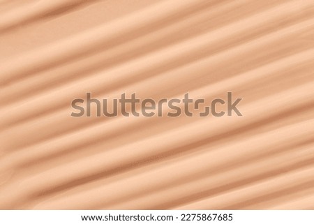 Cosmetic brown base product background. Beige paste texture. Powder face emultion smear. BB liquid sunscreen. Closeup hydrating cream. Abstract makeup lotion swatch. Beauty spa matte Royalty-Free Stock Photo #2275867685