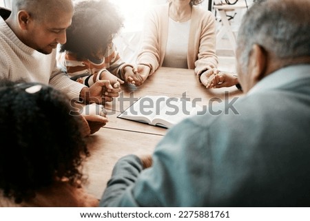 Holding hands, family and group praying, bible and support with quality time, connect and gratitude. People, believers and community with solidarity, religion and holy book with hope and faith in God Royalty-Free Stock Photo #2275881761