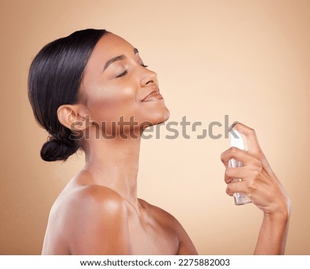 Perfume, woman or luxury fragrance product of a model feeling confident about parfume smell or skincare. Spa, marketing or dermatology aesthetic of spray bottle for neck or girl self care in studio Royalty-Free Stock Photo #2275882003