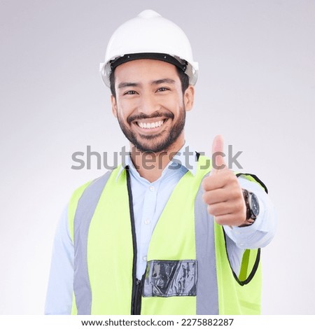 Thumbs up of engineering man face isolated on a white background support, like or success in project management goals. Asian construction worker or architect contractor thank you hand sign in studio