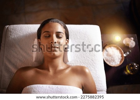 This is bliss. a beautiful young woman relaxing during a spa treatment. Royalty-Free Stock Photo #2275882395