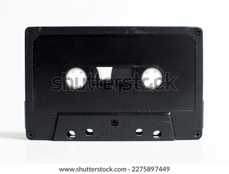 Dusty old magnetic tape on a white background  Royalty-Free Stock Photo #2275897449
